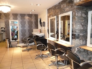 The Salon’s styling stations and stone feature wall